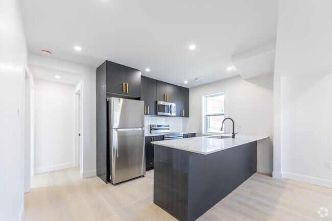 2 chambres, 1 salle de bain - 645 pi2 - Cuisine - Mad Mill Apartments