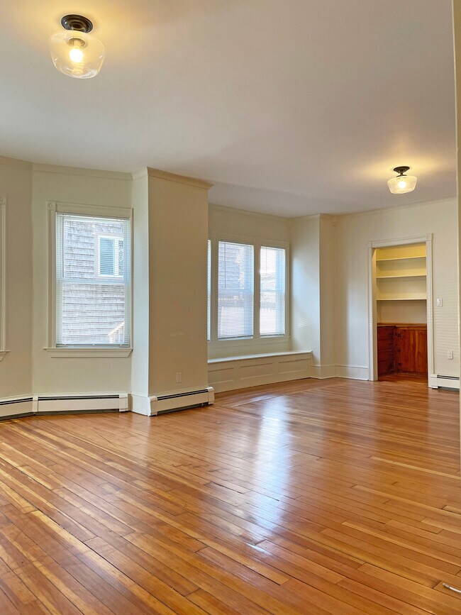 Living room / Dining room - refinished original hardwood floors - 228 Doyle Ave Apartments Unit Ground Floor