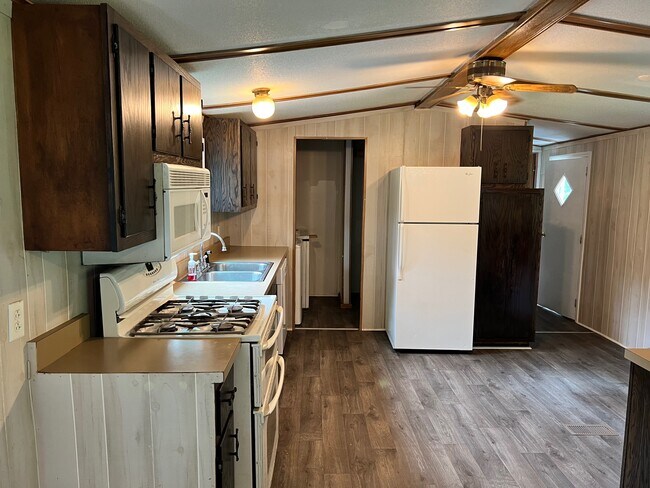 Kitchen with adjacent laundry room
