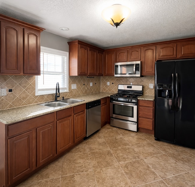 Photo - SEE IT NOW: Charming Home with Spacious Living, Modern Kitchen & Private Driveway in Overland Park!