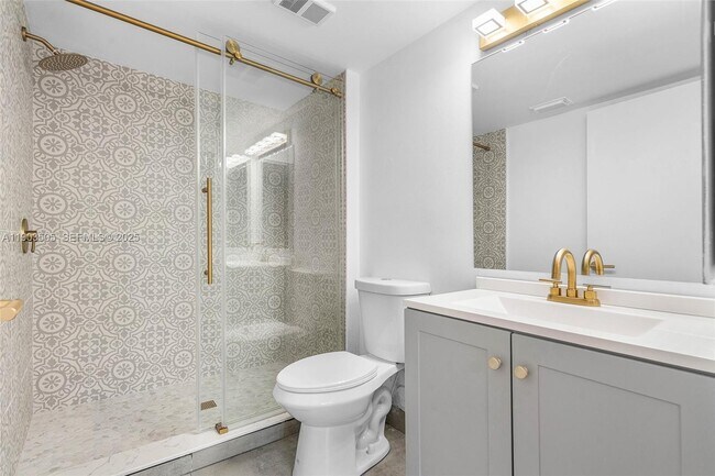 Building Photo - 8721 Wiles Rd Unit 105