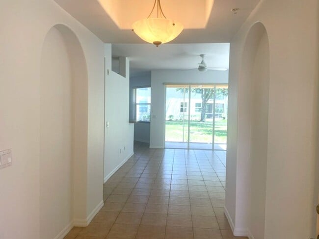 Photo - Elegant 3 Bedroom End-Unit Condo with Screened Lanai & Pond Views and A Private Garage