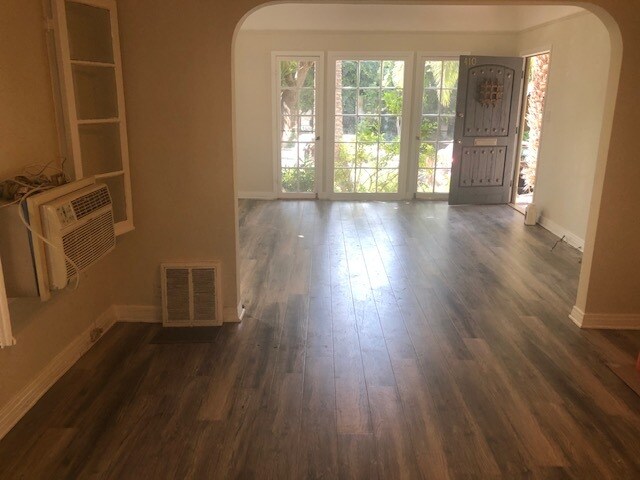 VIEW OF LIVING AND DINING ROOM AND FRENCH WINDOWS