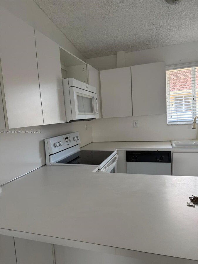 Photo - 10003 W Okeechobee Rd Apartment Unit 202