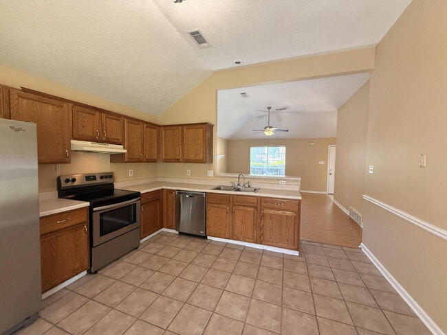 Photo - "Charming 3-Bedroom Lakeland Home with Cozy Fireplace & Gleaming Hardwood Floors!"