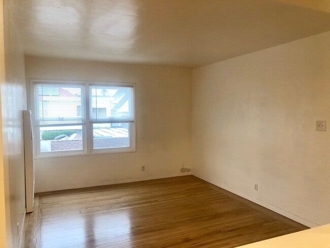 Photo - Remodeled top floor 1 Bd with hardwood flooring and spacious modern kitchen! Unit C