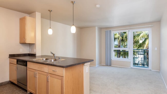 Carpeted Living Room with Balcony