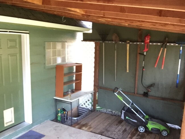 In the backyard there is a covered patio to keep you dry during the rainy months in Oregon.