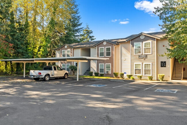 Well-maintained apartment community with covered parking and landscaped surroundings.