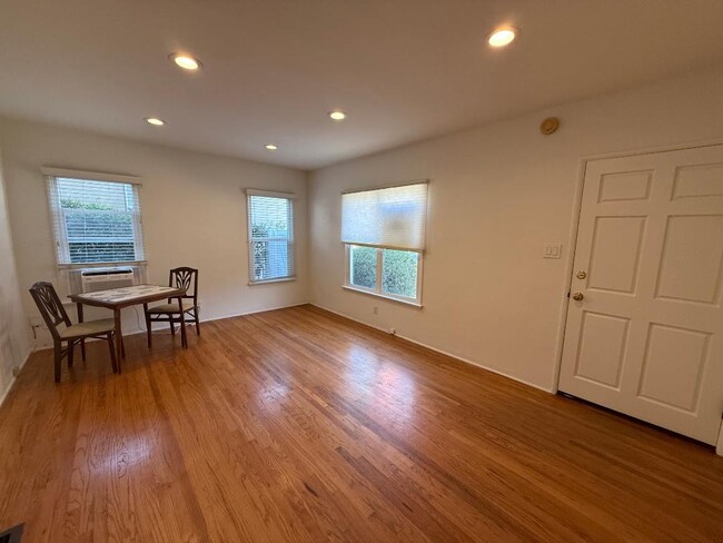 Living room with recessed ceiling lights. - 1755 Silver Lake Blvd Unit 1755