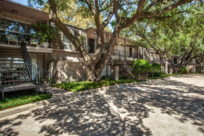 Experience a boutique living community with lush landscaping, reserved covered parking, and valet trash pickup - The Bordeaux Apartments