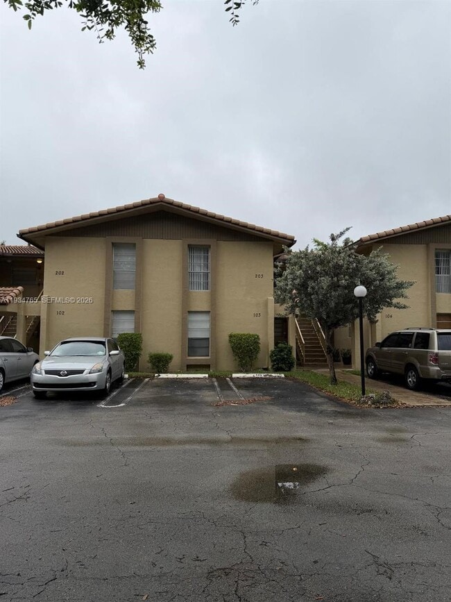 Building Photo - 11101 Royal Palm Blvd Unit 203