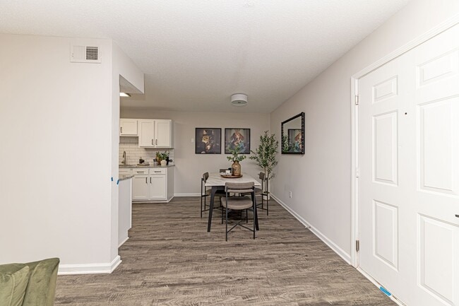 Dining area with hardwood-style flooring