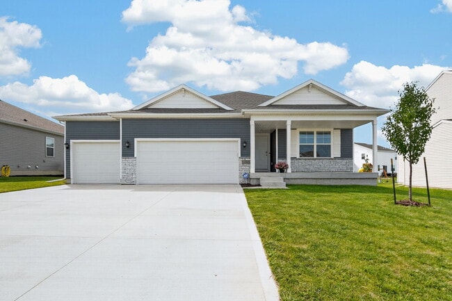 3 car garage ranch with large covered front porch