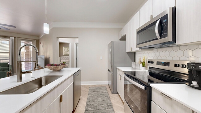 Newly Renovated Kitchen with Stainless Steel Appliances - The Retreat at Quail North Apartments