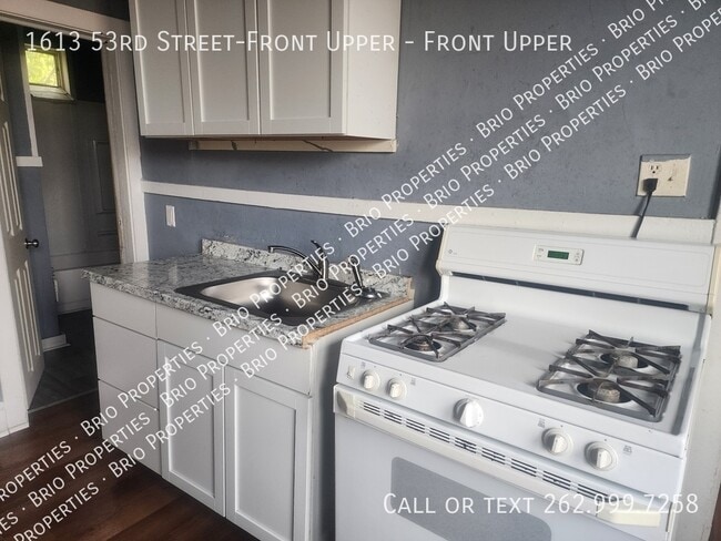 Building Photo - 1613 53rd St Unit Front Upper