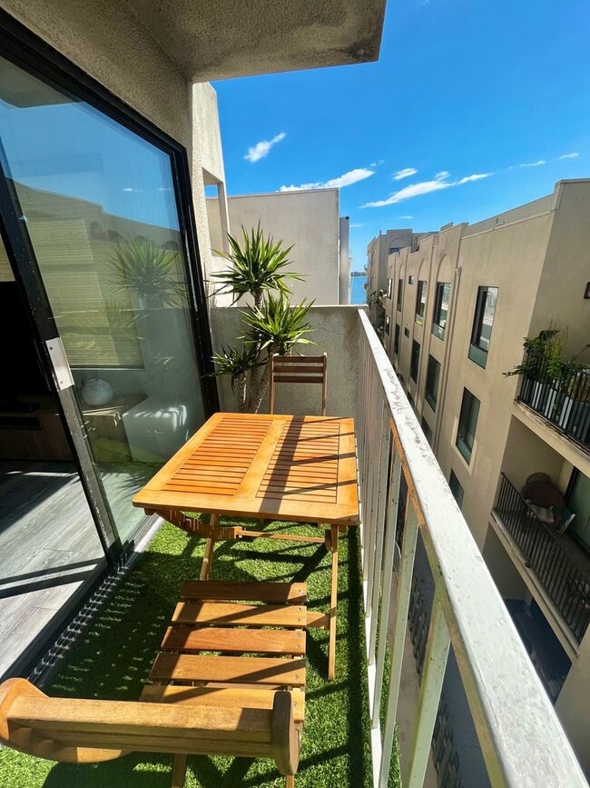 Photo - Live in Luxury Right on the Bay! Assigned Parking! Peek A Boo Bay View!