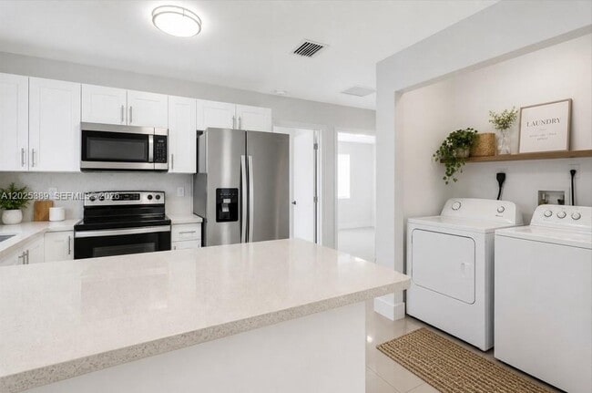 Building Photo - 1180 NW 67th St Unit 2