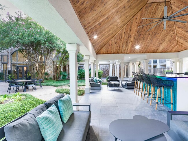 Lounge under the pavilion with comfortable seating, a ceiling fan, and a vibrant poolside bar just steps away. - Alister Sunset Valley