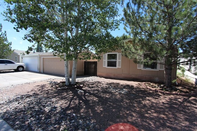 Photo - Bright 3-Bedroom Home with Fenced Yard + Detached 2-Car Garage