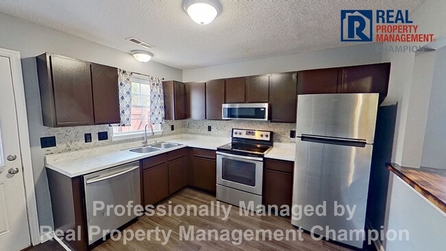 Photo - Charming 2BD/2 BA End Unit Townhouse w/Fireplace and Fenced Backyard