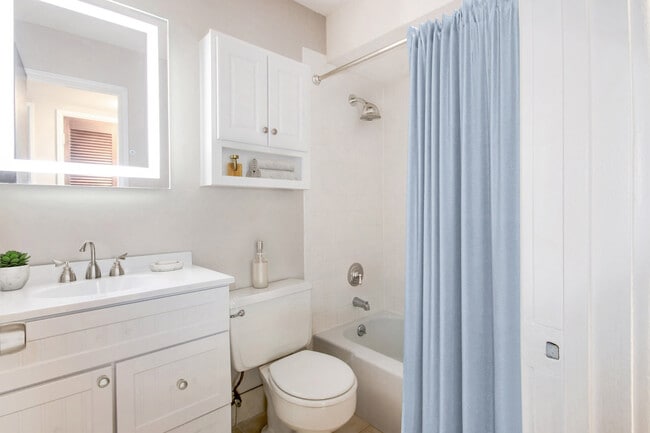 White Bathroom with Sink Vanity and Tub & Shower Combination