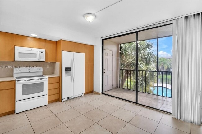 Building Photo - 8540 SW 133rd Avenue Rd Unit 312