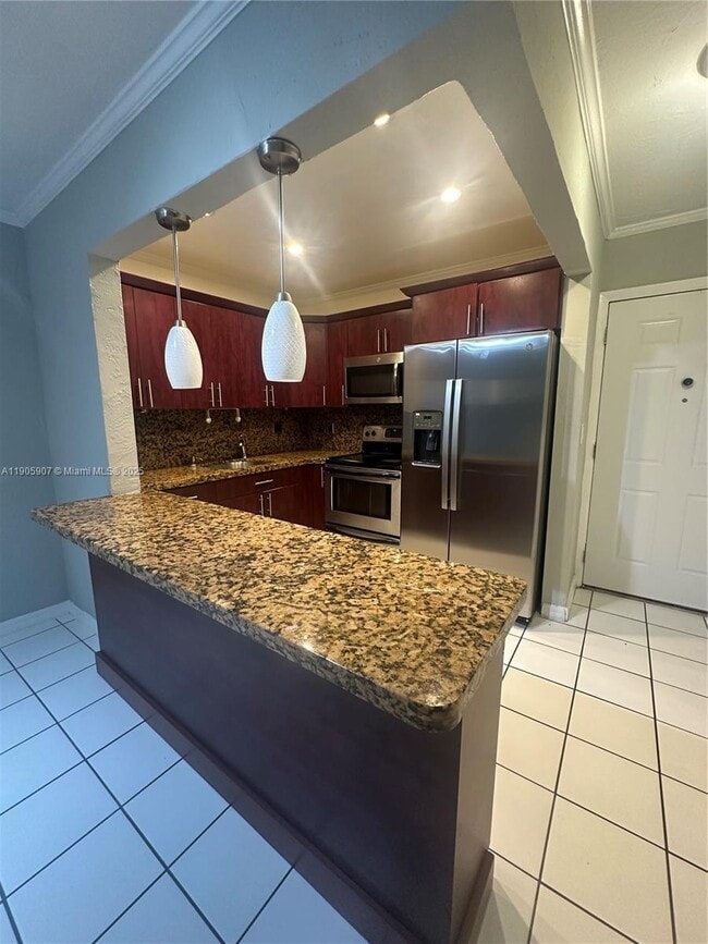 Building Photo - 1275 W 35th St Unit 60B