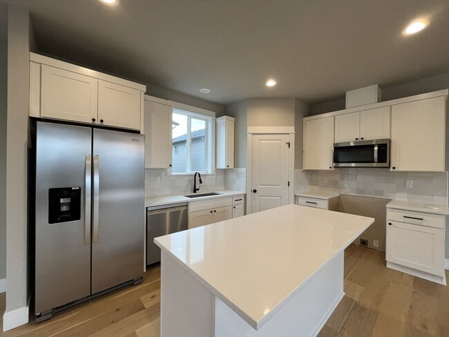 Photo - Brand New Spacious and Light-Filled Condo Offering an Open Layout, Island Kitchen, and Outdoor Deck