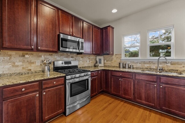 Photo - Welcome to this stunning 3-bedroom, 3.5-bath tri-level condo!