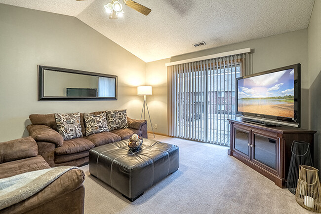 Relax in your cozy living room, with plenty of space for all your furniture. - Fountain Glen Apartments