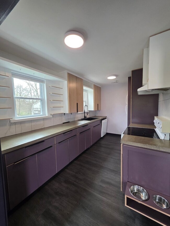 Photo - Charming 2BR with Walk-Out Basement, Fenced Yard & Flexible Murphy-Bed Office