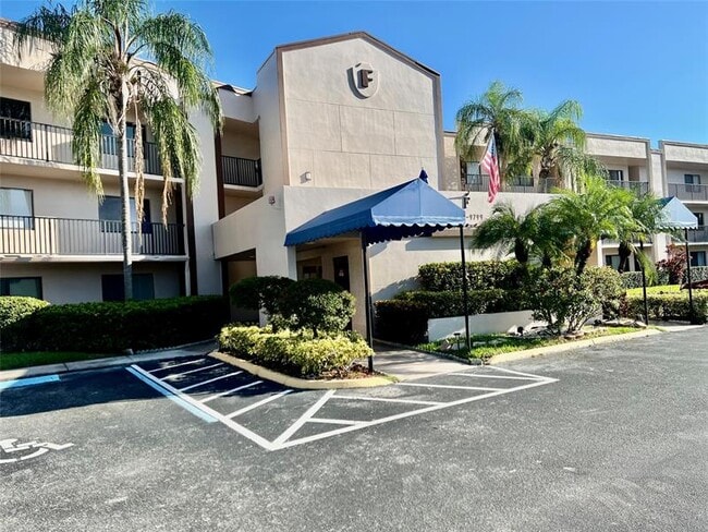 Building Photo - 9767 N Belfort Cir Unit 205