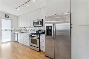 Photo - 7440 Byron Ave Unidad 1B