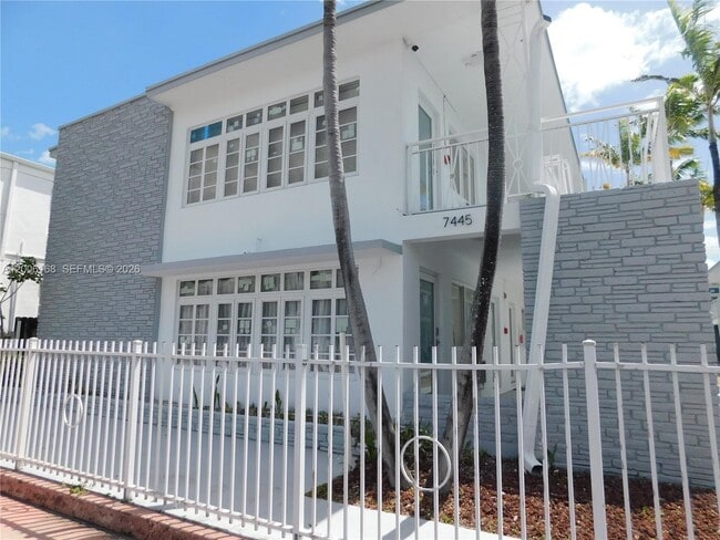 Building Photo - 7445 Harding Ave Unit 210