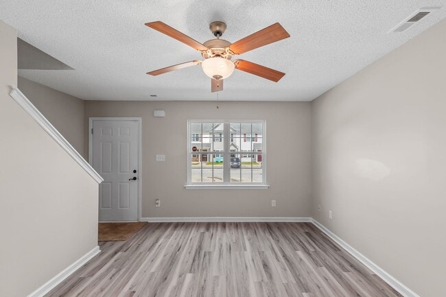Photo - Charming 2-Bedroom 2.5-Bathroom Townhouse with Fenced Yard