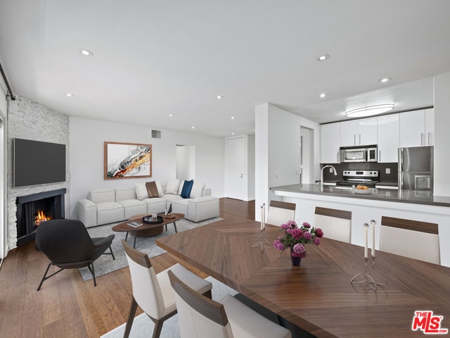 Wide Angle view of Dinning/Kitchen/Living room - 141 S Clark Dr Unit 408