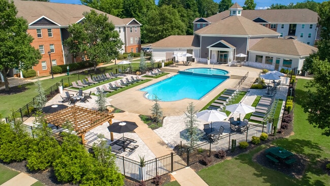Relax at our fenced pool area featuring ample lounge seating for residents, professionally operated by Highlands Vista Group.
