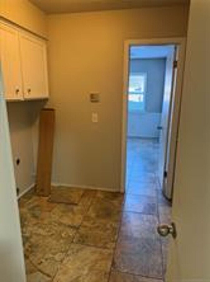 Photo - 2 story house for lease. Open floor plan in kitchen & living. Lots of storage. Large fenced backy...