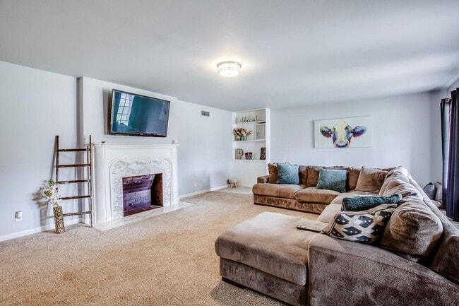 Photo - Spacious 4-Bedroom Home with Dual Living Areas