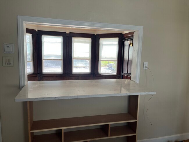 quartz counter opening to living room - 61 Wall St Unit #3