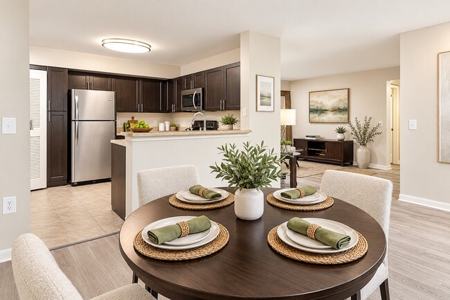 Elevate your lifestyle at Club Lake Pointe with this beautifully designed kitchen and dining area, perfect for gatherings and creating lasting memories. Enjoy modern amenities in a serene setting. Schedule your tour today!