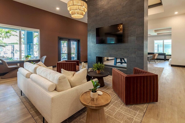 Gather around the dramatic double-sided fireplace in our open-concept clubhouse lounge, designed for comfort and connection year round. - Garrett Gateway