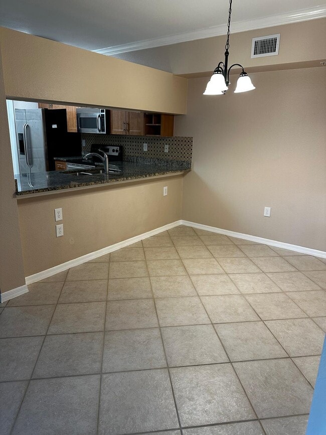 Building Photo - 6511 Emerald Dunes Dr Unit 206