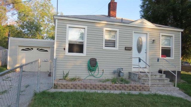 Front of home. Attached single car garage and additional off street parking. - 1505 E. Hayden Street