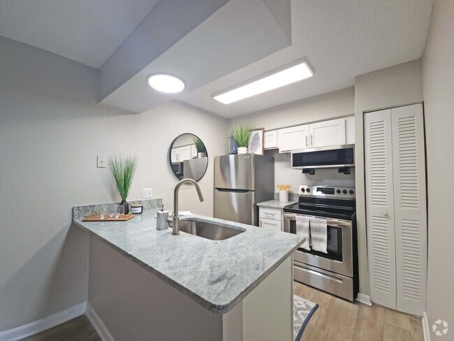 Kitchen with Granite Counters - Amalie Apartment Homes