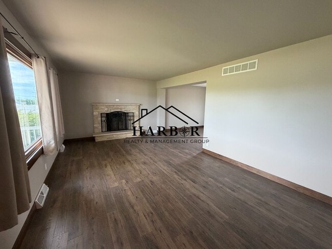 Photo - *1/2 Off First Months Rent* Spacious 3BR Home with 2-Stall Garage & Private Deck in Kasson