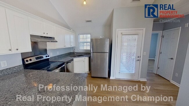 Photo - Immaculate 2 BD/2 BA Townhome with Open Floorplan and Split Bedrooms