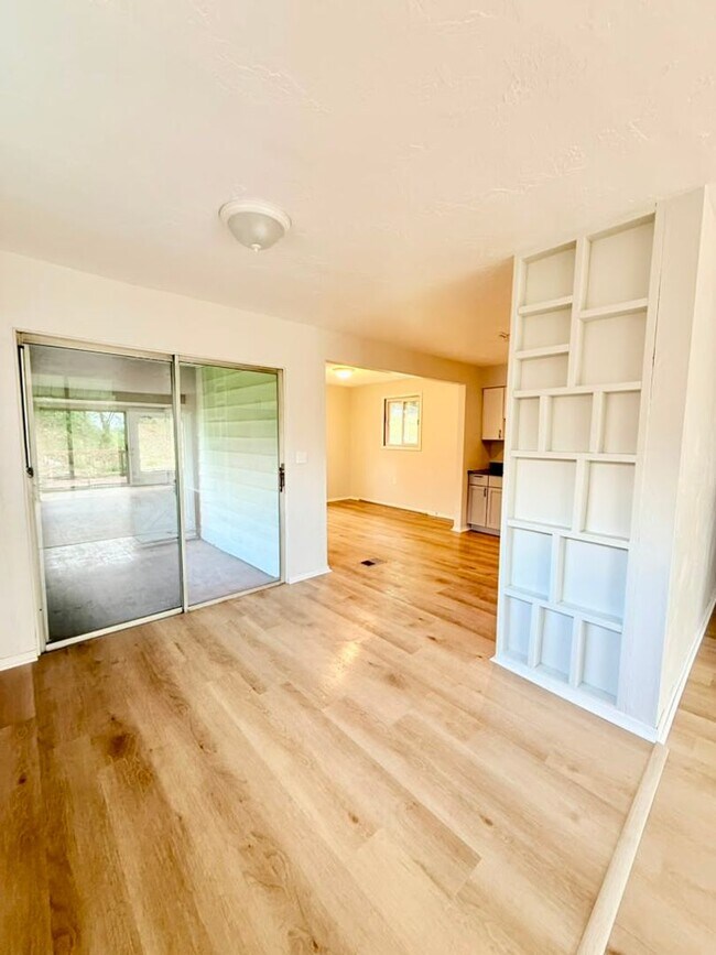 Photo - Newly remodeled 3-bedroom, 1.5-bath home featuring granite countertops, central A/C, and a partia...