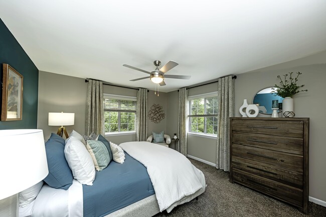 Cozy bedroom suite with ceiling fan